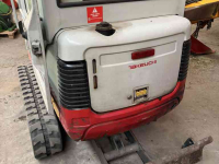 Excavator tracks Takeuchi TB016 met machinetrailer